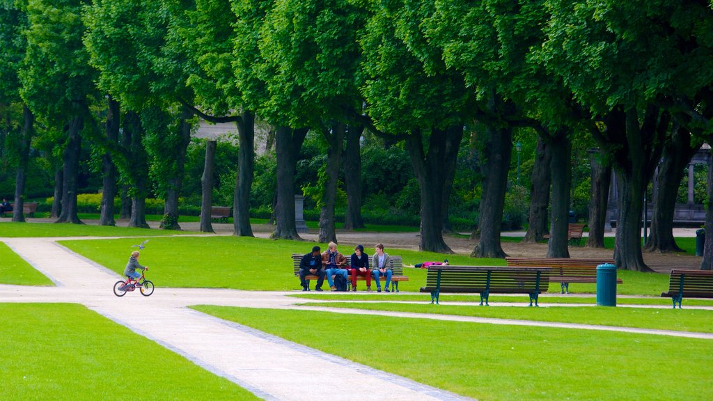 Jubilee Park featuring a garden as well as a small group of people