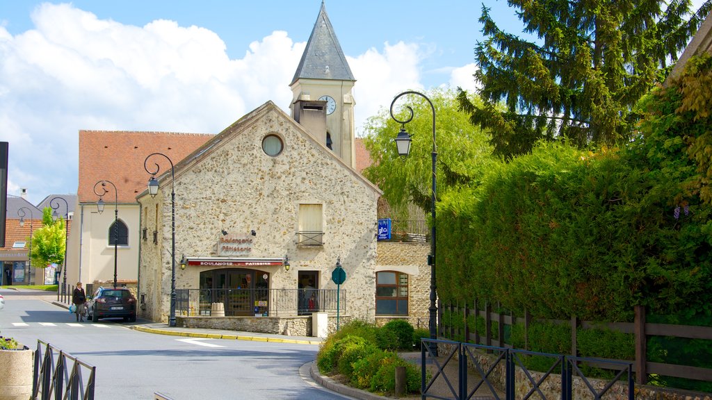 Magny-le-Hongre which includes heritage architecture, a small town or village and street scenes