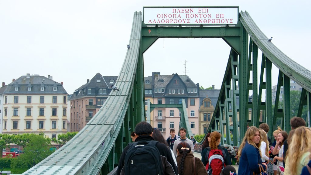 Frankfurt showing a bridge as well as a small group of people