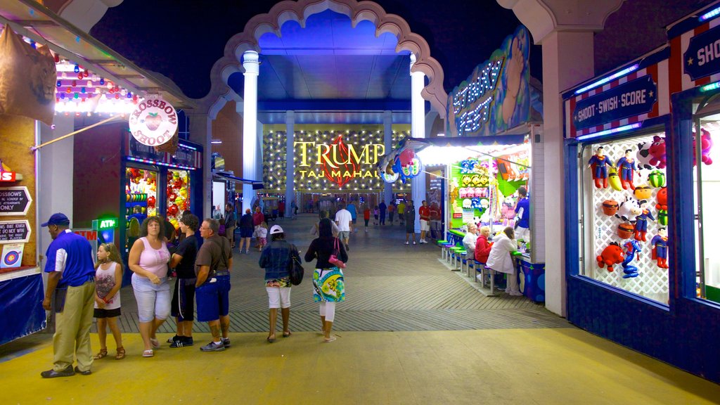 Steel Pier which includes night scenes, shopping and street scenes