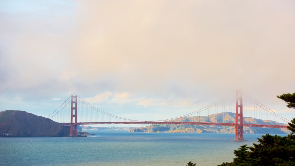 Coastal Trail showing a river or creek, a bridge and mist or fog