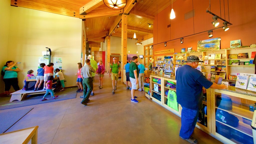 Kohm Yah-mah-nee Visitor Center which includes interior views as well as a small group of people