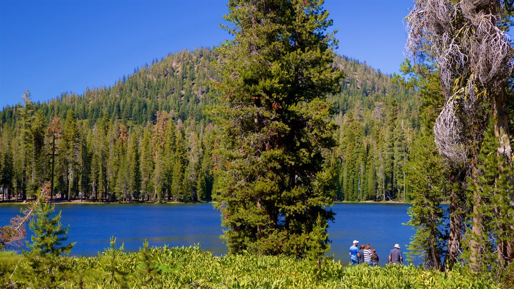 Summit Lake featuring a lake or waterhole as well as a small group of people