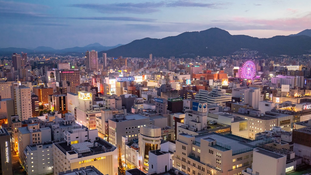 Sapporo TV Tower featuring landscape views, a sunset and a city