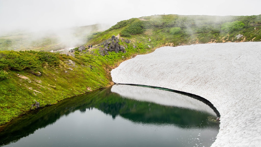 Daisetsuzan National Park which includes a lake or waterhole and mist or fog