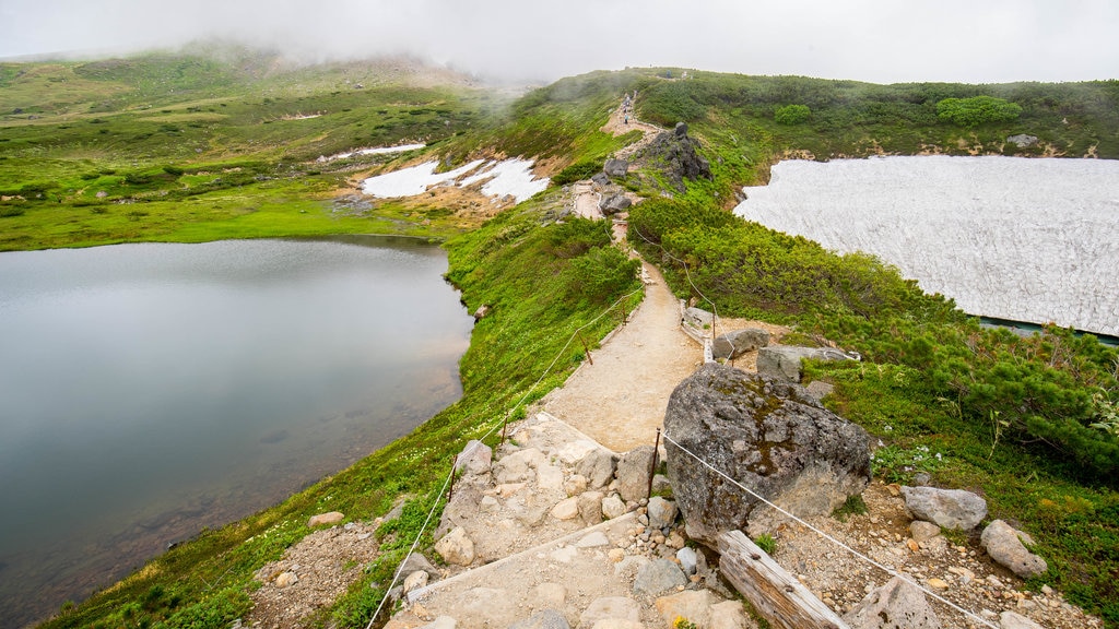 Daisetsuzan National Park which includes tranquil scenes and a lake or waterhole