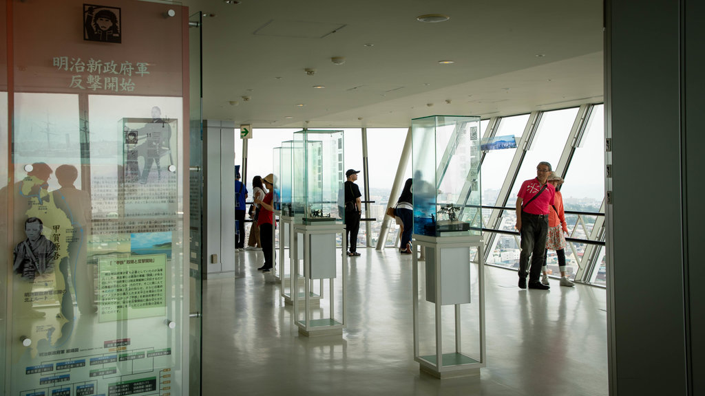 Goryokaku Tower featuring views and interior views as well as a small group of people