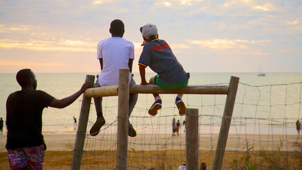 Mindil Beach featuring a sandy beach as well as a small group of people