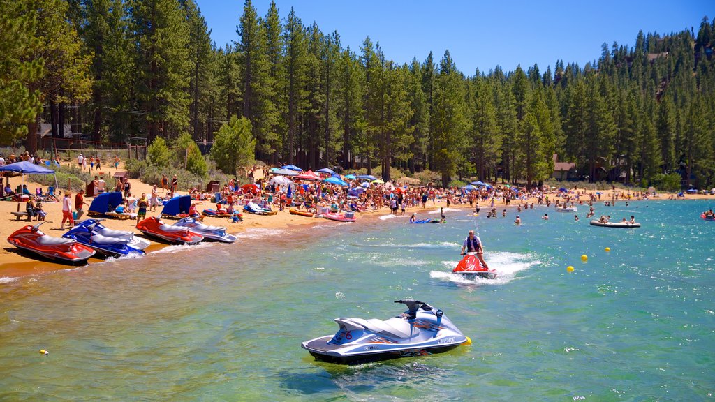 Zephyr Cove Beach which includes a sandy beach, forest scenes and jet skiing