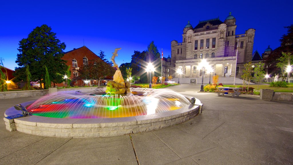 British Columbia Parliament Building showing a square or plaza, night scenes and a fountain