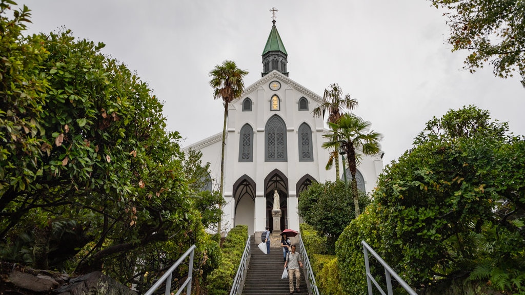 Oura Church which includes a church or cathedral and heritage architecture as well as a small group of people