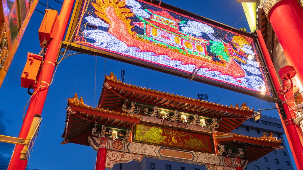 Shinchi Chinatown featuring night scenes, signage and heritage elements