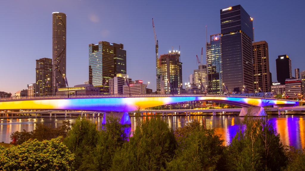 South Bank Parklands which includes a river or creek, a city and night scenes