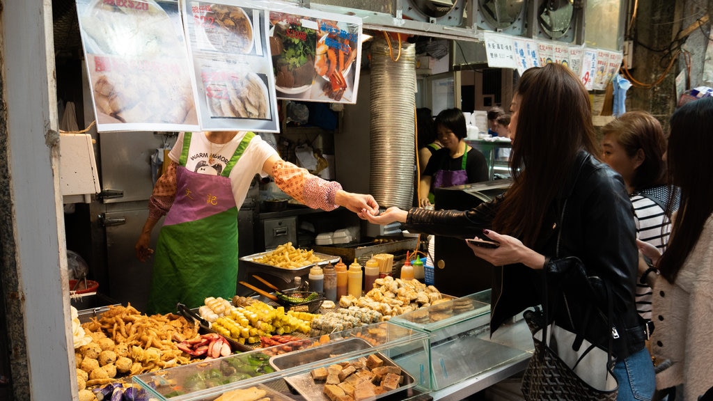 Ladies\' Market featuring food and markets as well as an individual female