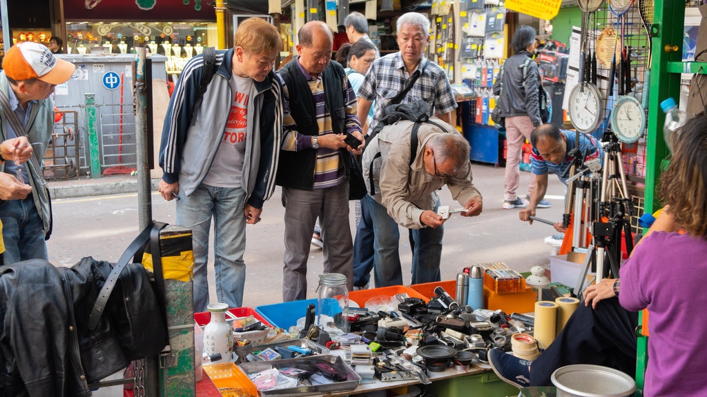 Apliu Street Market showing street scenes and markets as well as a small group of people