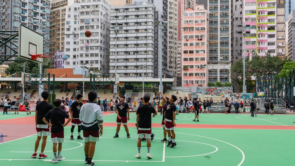 Wan Chai showing a sporting event and a city as well as a small group of people