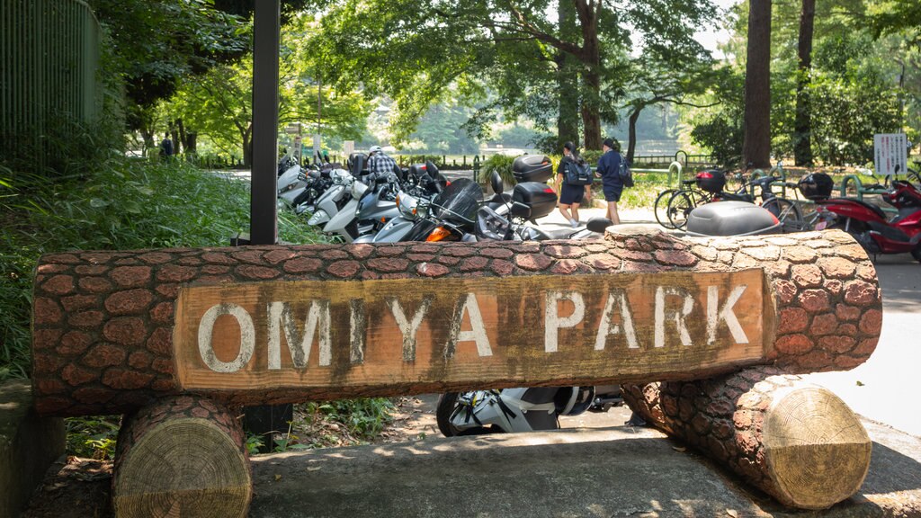 Omiya Park showing a garden and signage