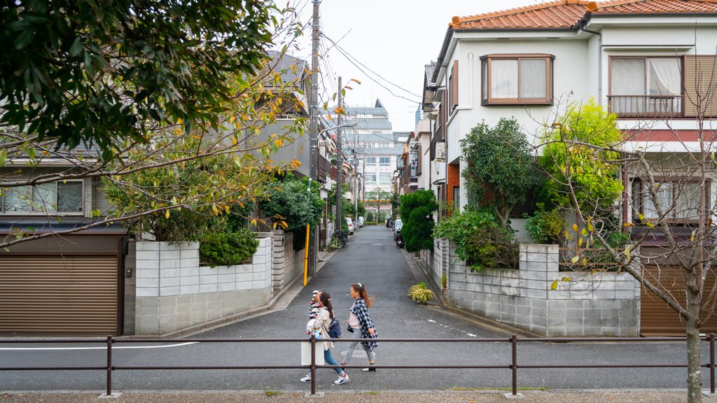 Ukita Park showing street scenes as well as a small group of people