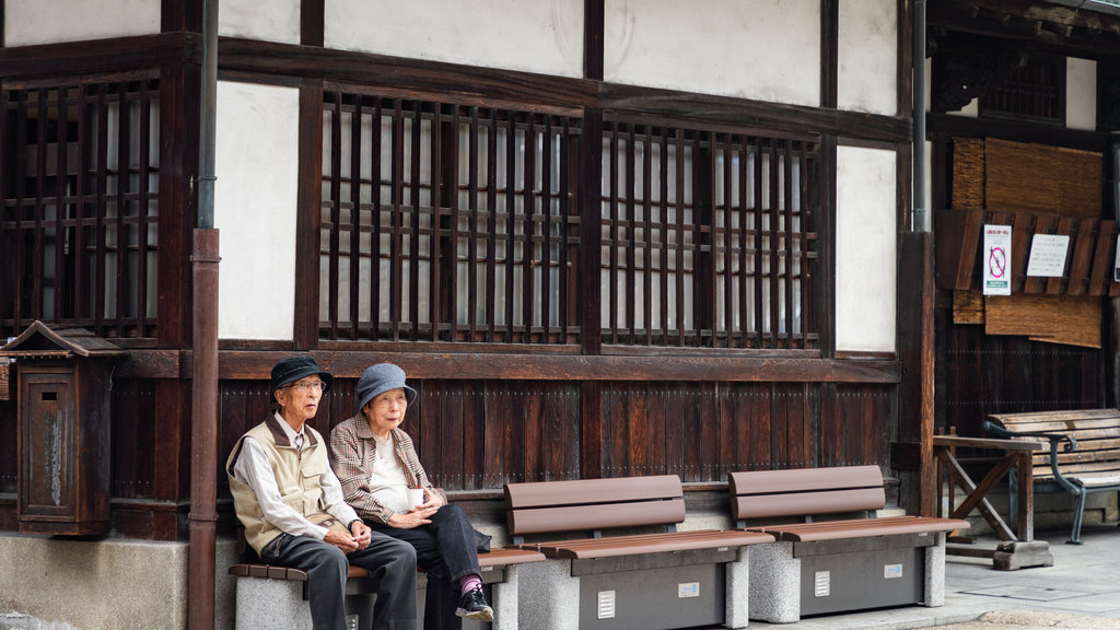 Dogo Onsen showing street scenes as well as a couple