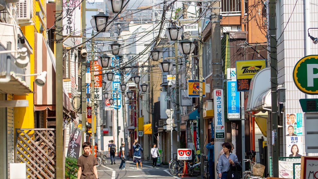 Minaminagasaki showing street scenes and a city