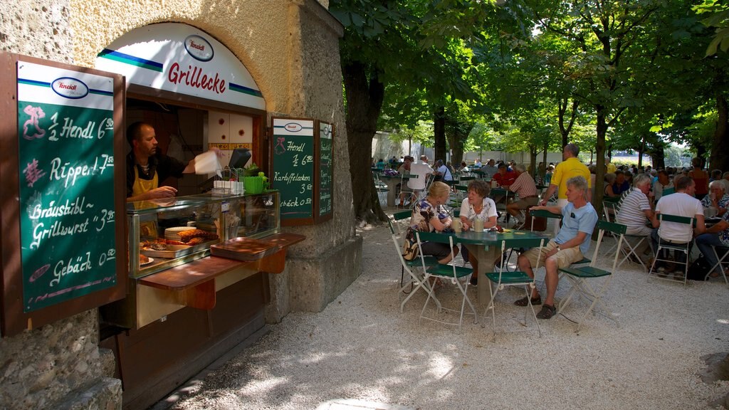 Augustiner Brewery showing cafe scenes and shopping as well as a large group of people