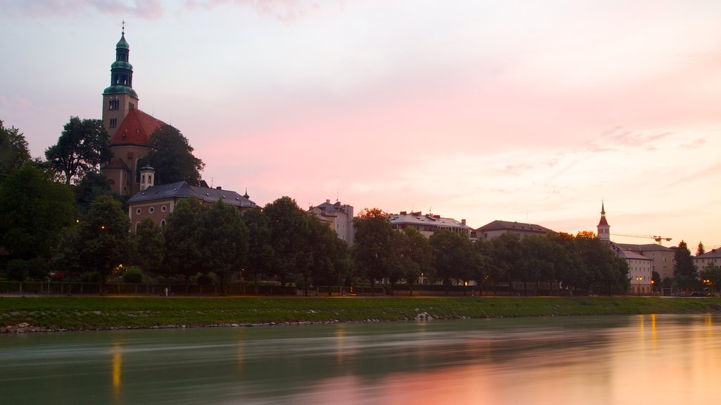 Mirabell Palace featuring a sunset, a river or creek and château or palace