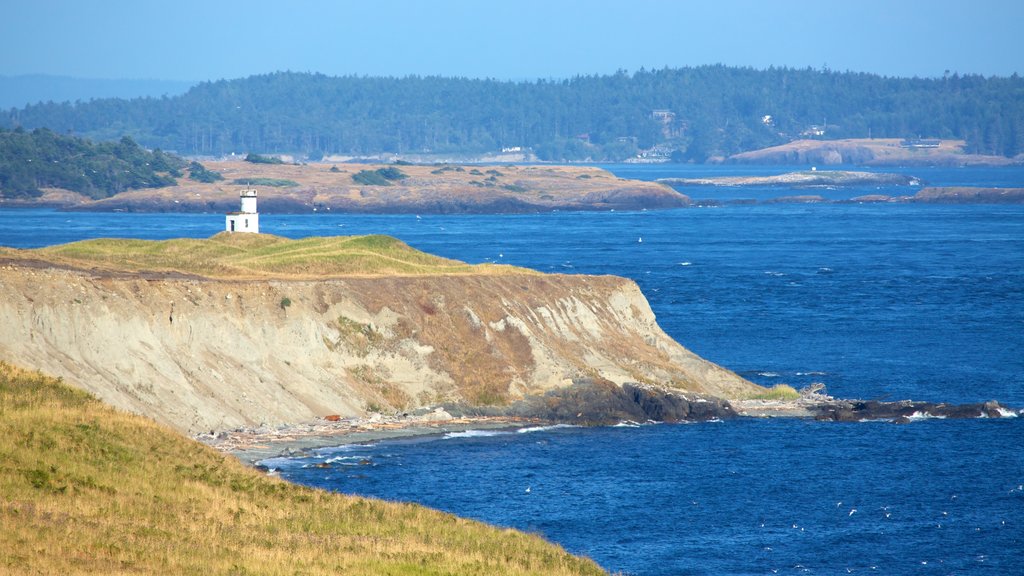 San Juan Island featuring a lighthouse, rocky coastline and landscape views