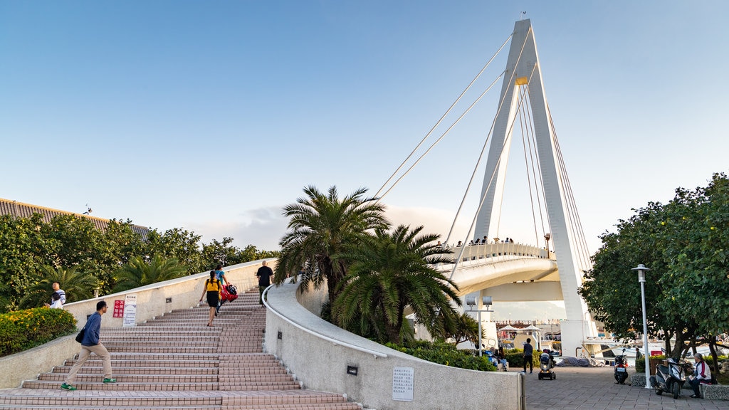 Tamsui Fisherman\'s Wharf showing a bridge and a sunset