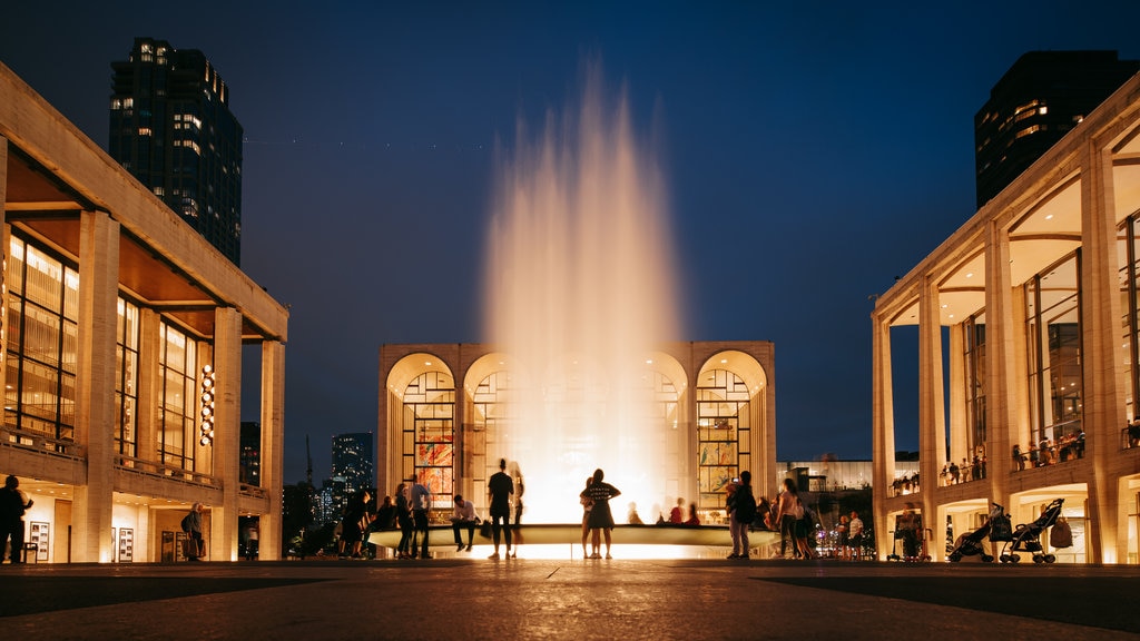 Lincoln Center which includes a fountain, street scenes and night scenes