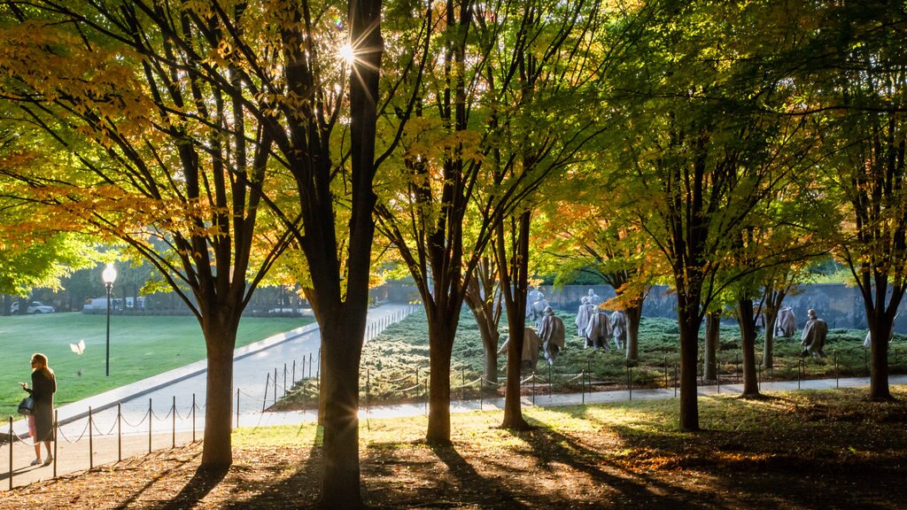 Korean War Veterans Memorial showing a sunset and a garden