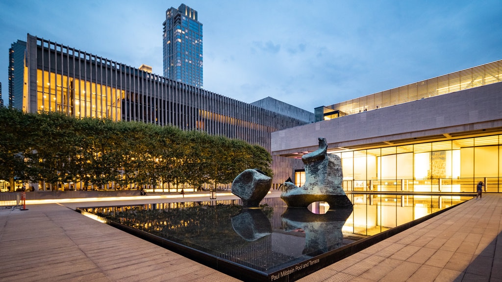 Lincoln Center which includes outdoor art, night scenes and a fountain