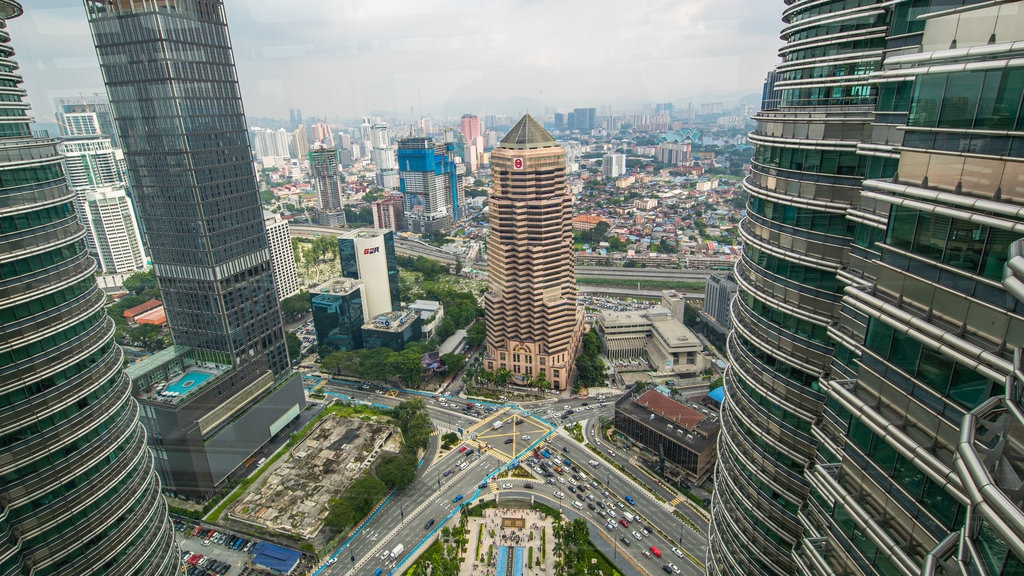 Petronas Twin Towers showing a high-rise building, a city and landscape views