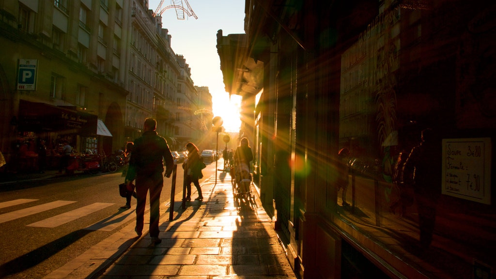 7. Arrondissement som omfatter en solnedgang, en by og gadeliv