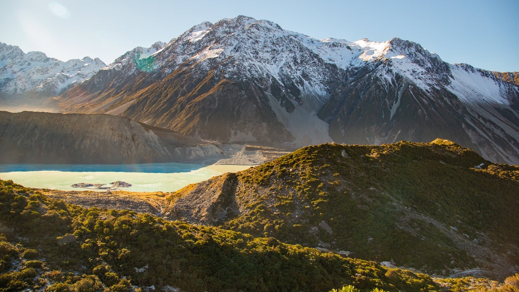 Parque Nacional Monte Cook que inclui um pôr do sol, neve e montanhas