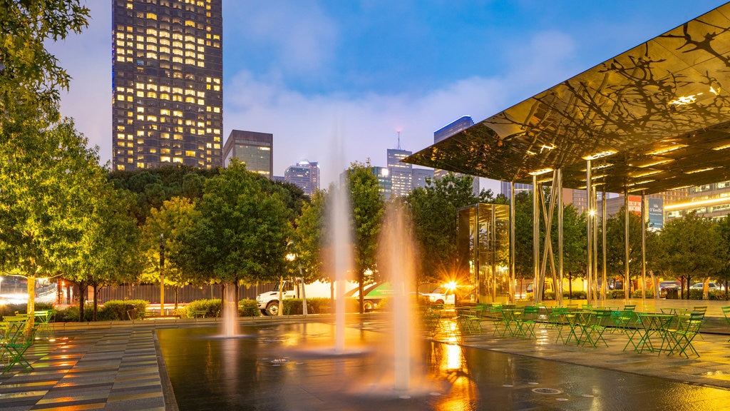 Klyde Warren Park showing a fountain and night scenes