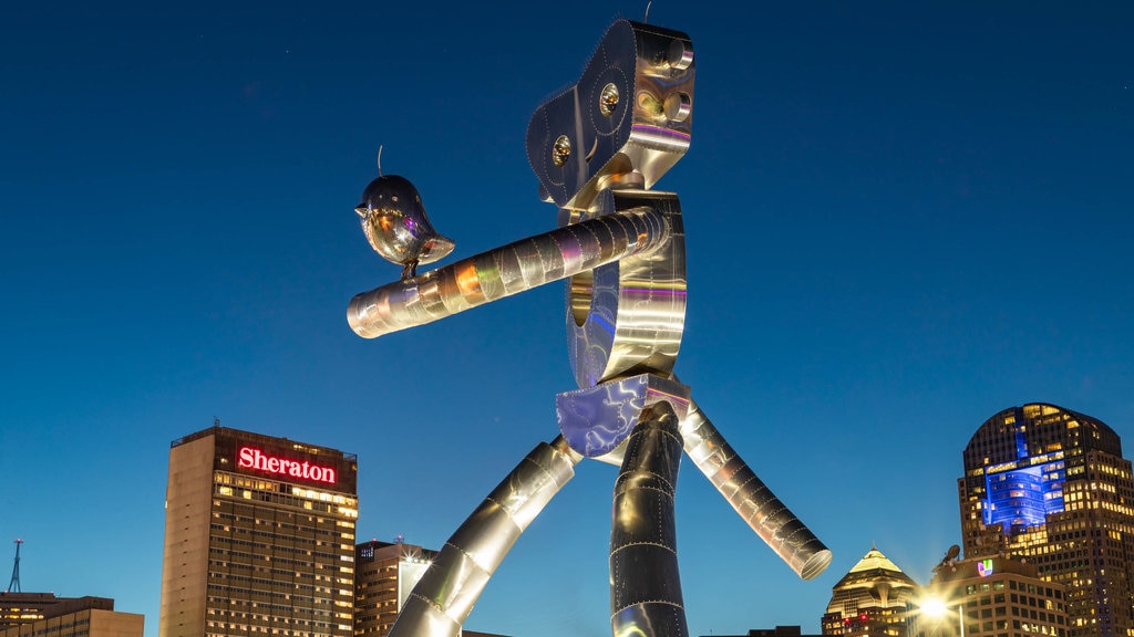 Deep Ellum which includes outdoor art, night scenes and a city