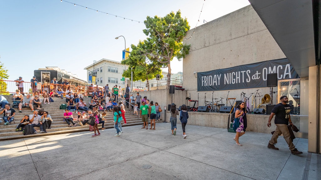 Oakland Museum of California showing street scenes as well as a large group of people