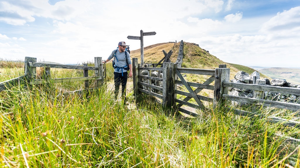 Peak District featuring farmland as well as an individual male