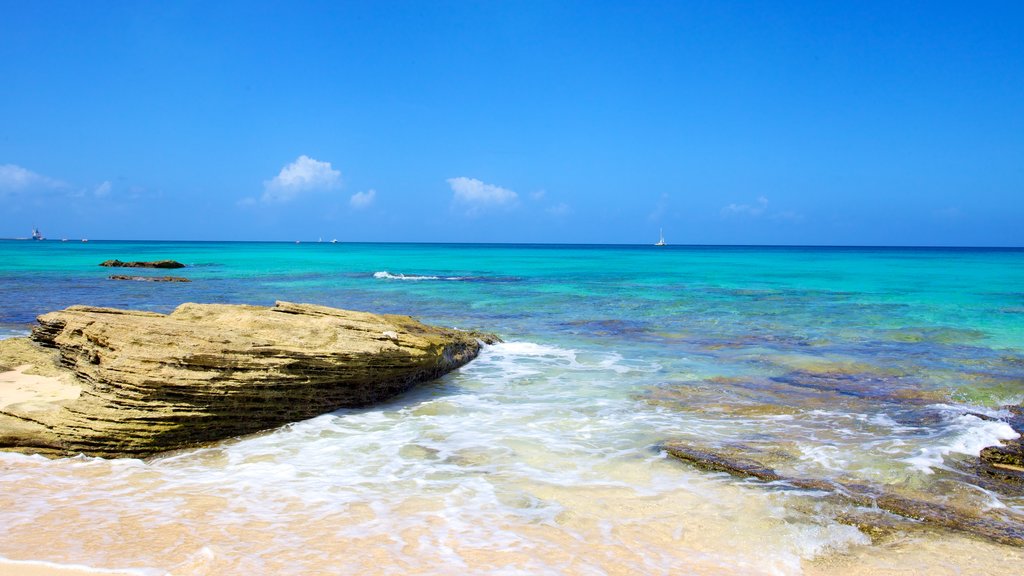 Paradise Beach featuring rocky coastline, a sandy beach and landscape views