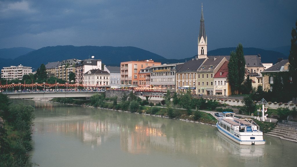 Villach featuring a ferry, a bridge and a lake or waterhole