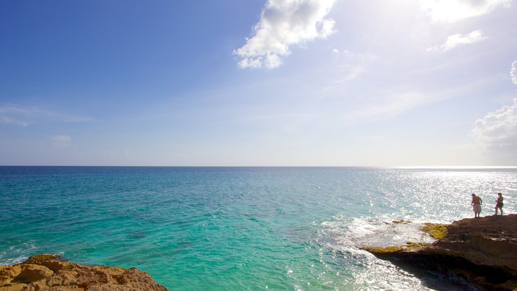 Cupecoy Beach showing rocky coastline and landscape views