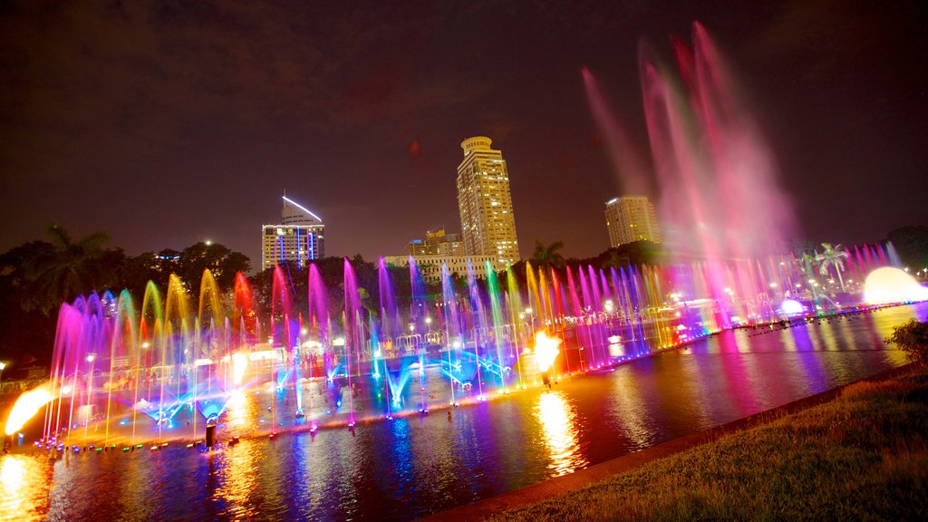 Parque de Rizal caracterizando uma fonte, uma cidade e um jardim