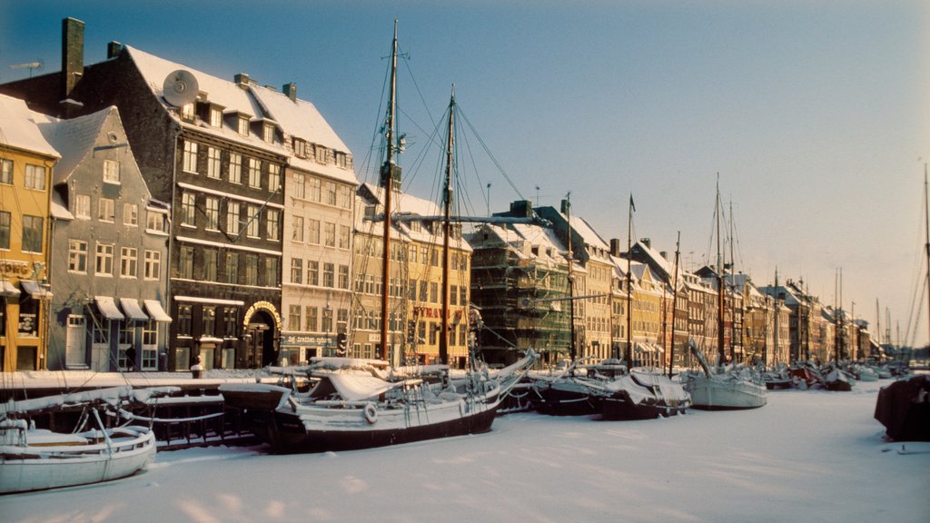 Nyhavn showing a marina, sailing and snow