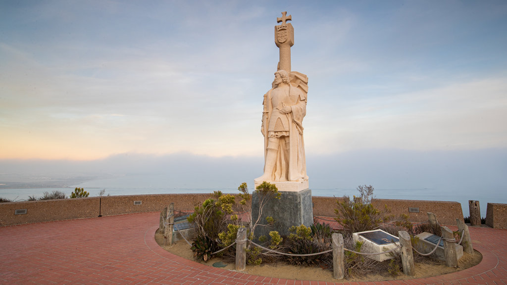 Cabrillo National Monument featuring a sunset, views and a statue or sculpture