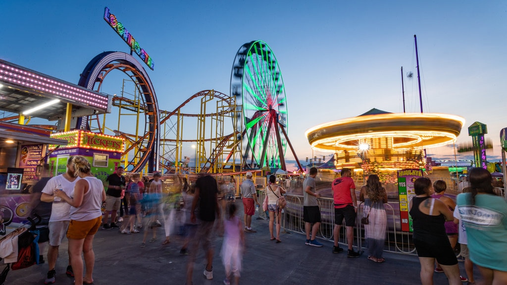 Jolly Roger at the Pier featuring night scenes and rides