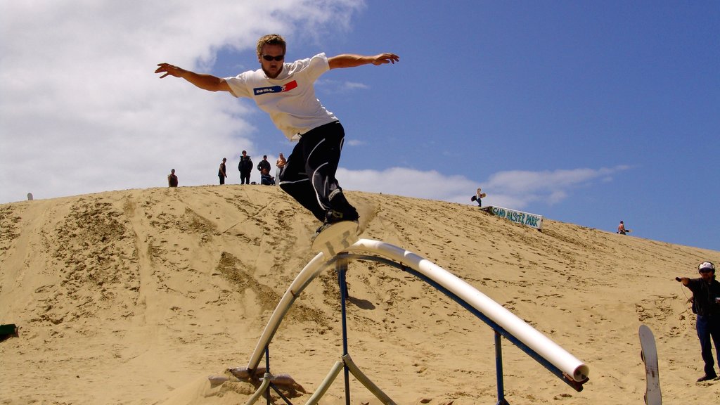 Florence featuring a sandy beach as well as an individual male