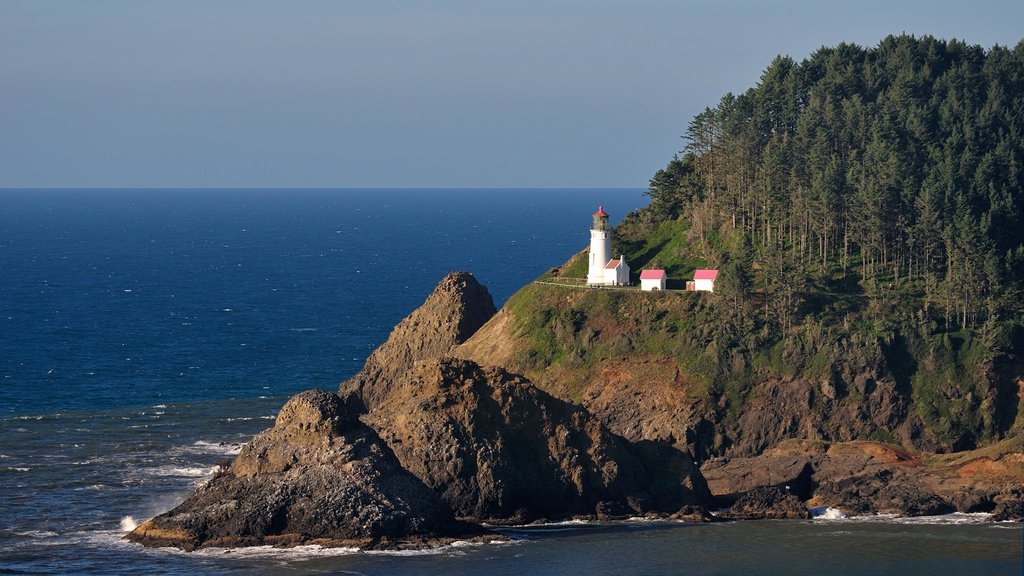 Florence featuring general coastal views, a lighthouse and rocky coastline