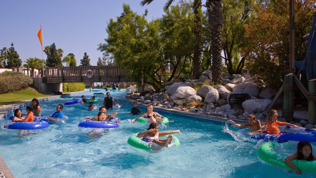 Knott\'s Berry Farm featuring a water park and swimming as well as a small group of people