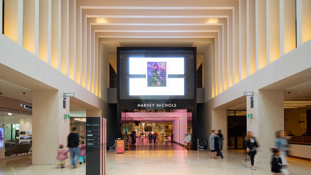 The Mailbox showing signage, shopping and interior views