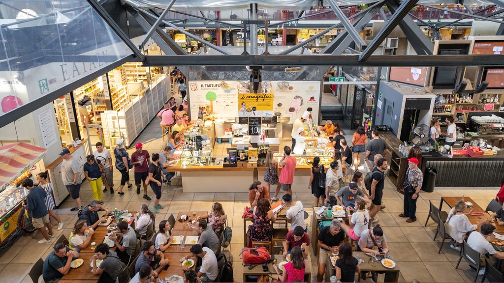 Central Market featuring dining out and interior views as well as a large group of people